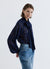 Blusa in pizzo con fiocco al collo