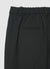 Trousers with pleats and elasticated waistband