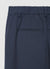 Trousers with pleats and elasticated waistband