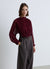 Pleated blouse with high neck