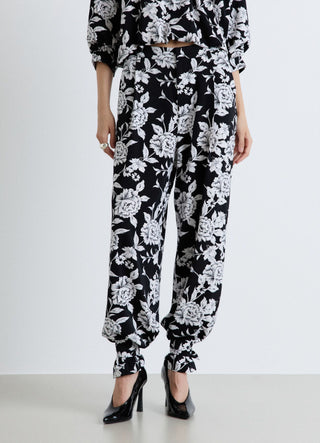 Pantaloni palazzo a fiori con lacci al fondo
