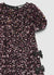 Robe à sequins avec nœuds latéraux
