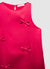Vestito smanicato con fiocchi applicati